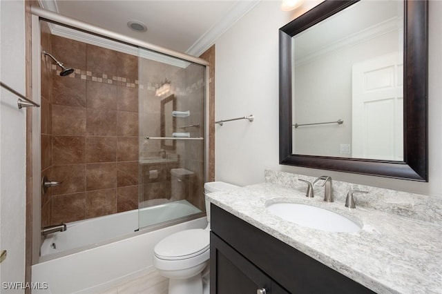 full bathroom with crown molding, vanity, toilet, and bath / shower combo with glass door