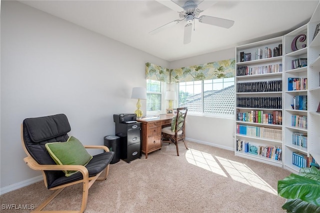 office space with carpet floors, baseboards, and a ceiling fan