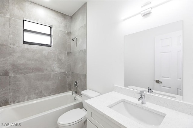 bathroom featuring toilet, shower / tub combination, and vanity