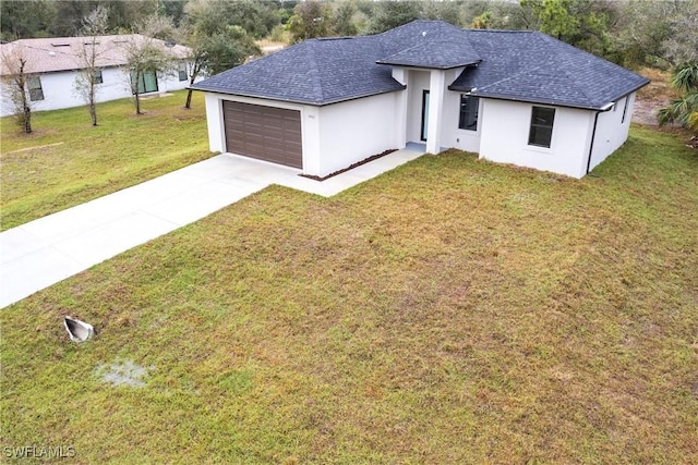 view of front of house featuring stucco siding, a shingled roof, concrete driveway, an attached garage, and a front lawn