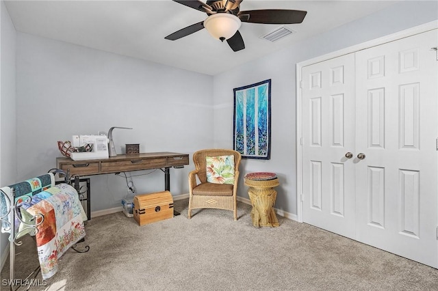 sitting room featuring carpet floors, baseboards, and visible vents