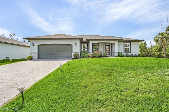 view of front of property with a garage, a front lawn, decorative driveway, and stucco siding