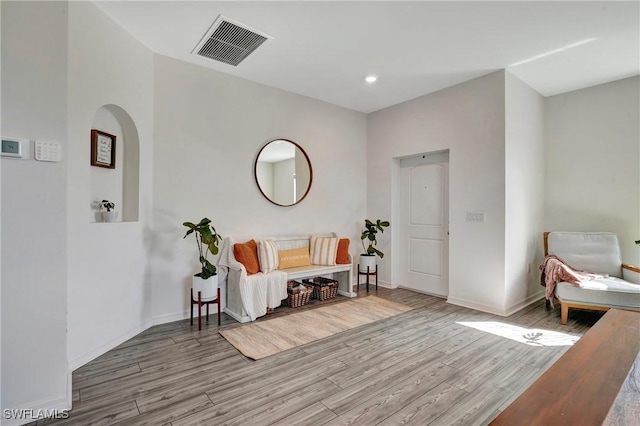 sitting room featuring recessed lighting, wood finished floors, visible vents, and baseboards