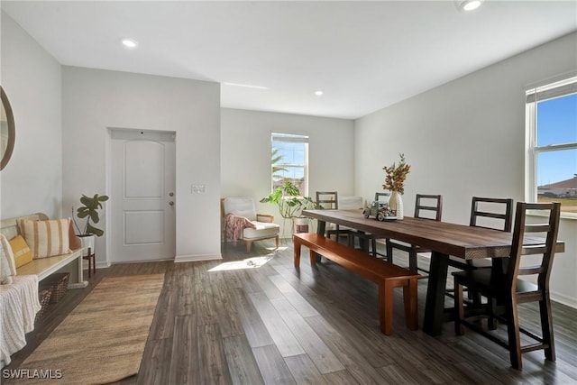 dining area with baseboards, dark wood finished floors, and recessed lighting