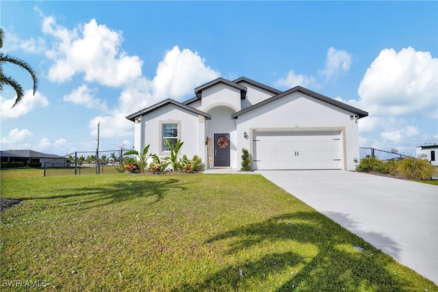 view of front of home with a garage, driveway, a front lawn, and stucco siding