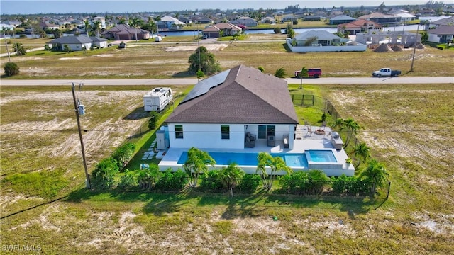 birds eye view of property with a residential view