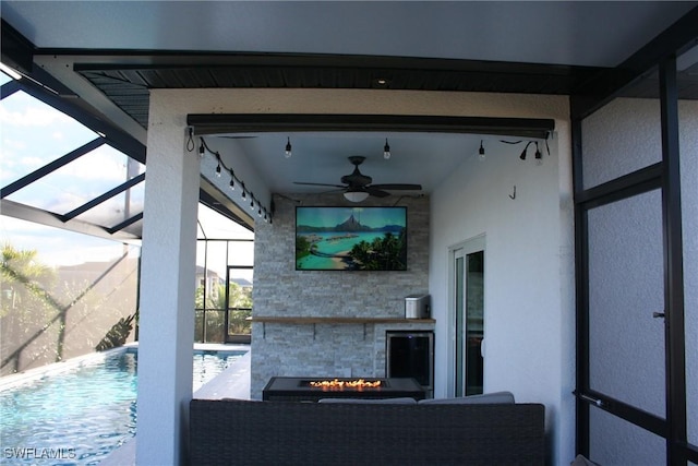 view of patio / terrace with glass enclosure and an outdoor pool