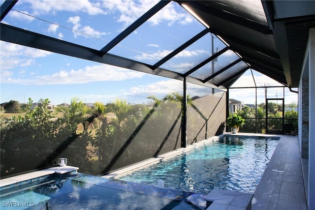 outdoor pool featuring glass enclosure