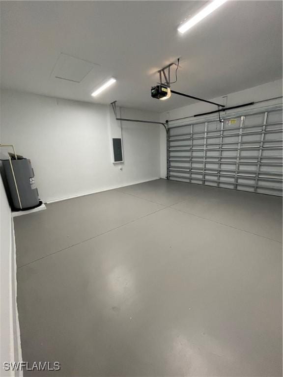 garage featuring water heater and a garage door opener