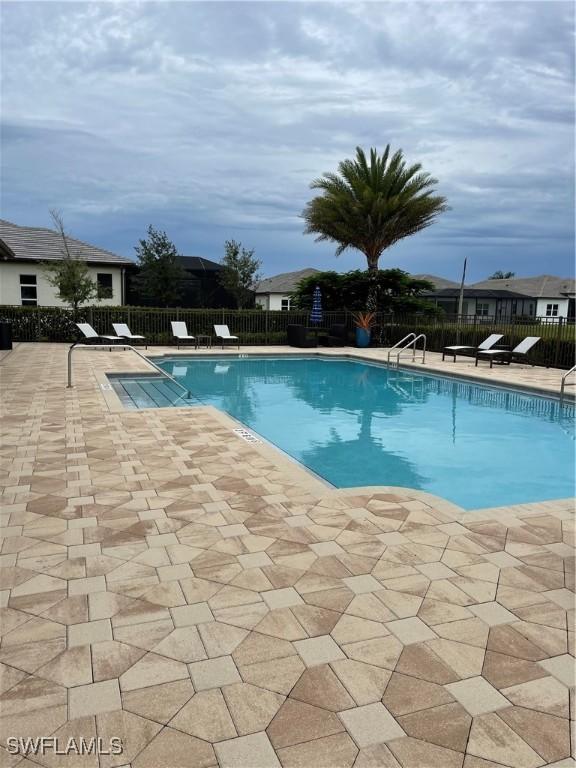 3608 Sapphire Cove Cir, Naples, FL 34114 - pool with a patio and fence