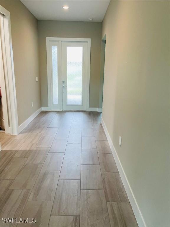 spare room featuring baseboards