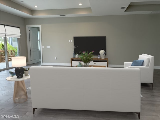 3608 Sapphire Cove Cir, Naples, FL 34114 - living area with a raised ceiling, recessed lighting, visible vents, and baseboards
