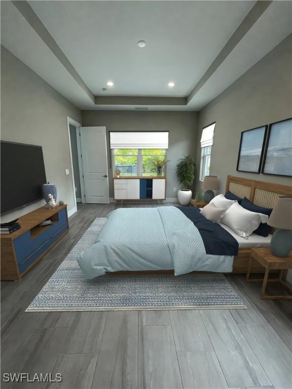 bedroom featuring recessed lighting, a raised ceiling, baseboards, and wood finished floors