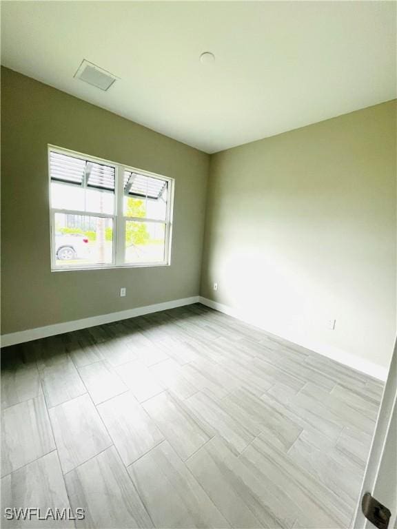 empty room with baseboards