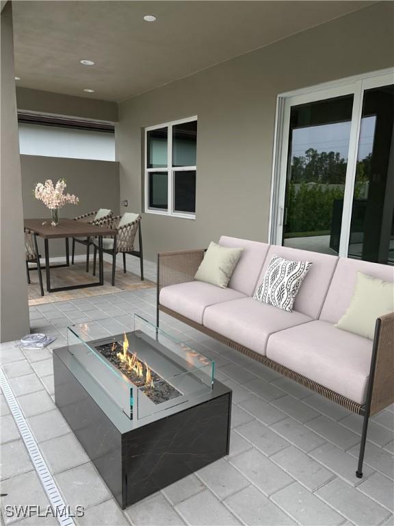 3608 Sapphire Cove Cir, Naples, FL 34114 - living area with tile patterned floors and recessed lighting