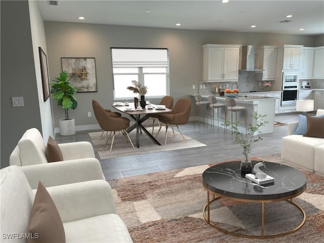 3608 Sapphire Cove Cir, Naples, FL 34114 - living area featuring baseboards, recessed lighting, visible vents, and light wood-type flooring