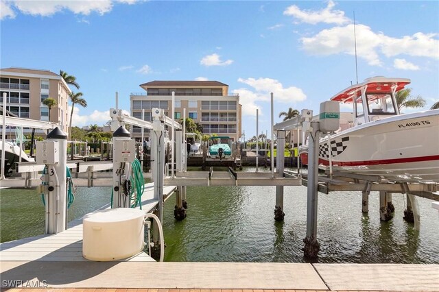 907 Panama Ct Unit 303, Marco Island, FL 34145 - dock area featuring boat lift and a water view