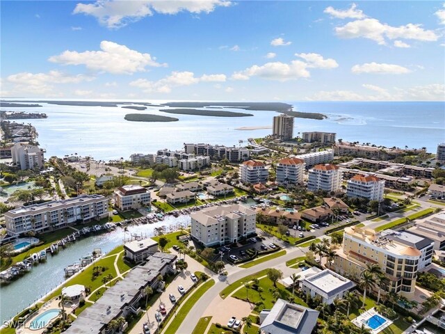 907 Panama Ct Unit 303, Marco Island, FL 34145 - drone / aerial view featuring a view of city and a water view
