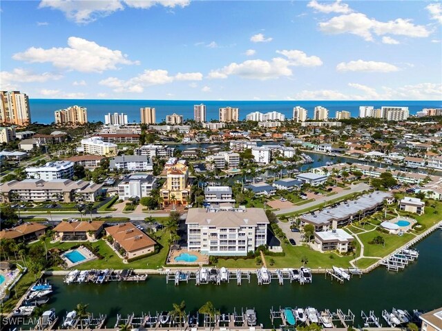 907 Panama Ct Unit 303, Marco Island, FL 34145 - drone / aerial view featuring a water view and a city view