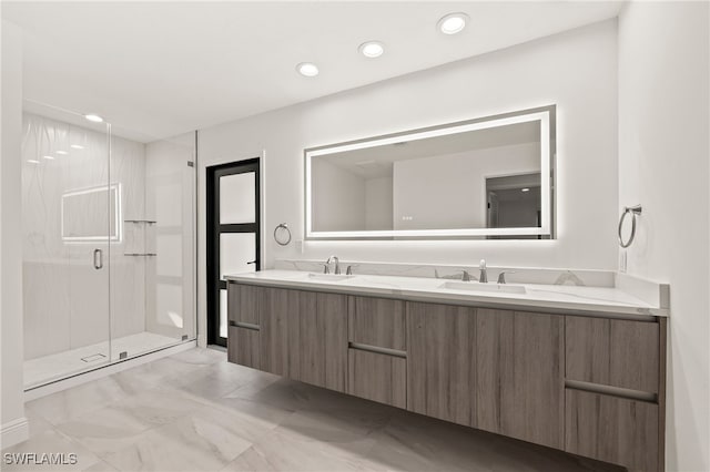 bathroom featuring double vanity, a stall shower, a sink, and recessed lighting