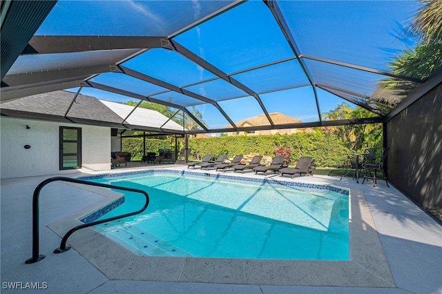 pool with a lanai and a patio