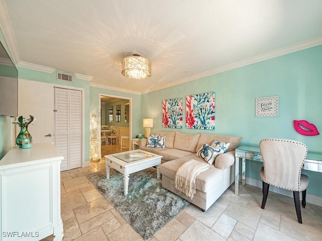 living room featuring a notable chandelier, stone tile floors, visible vents, baseboards, and crown molding