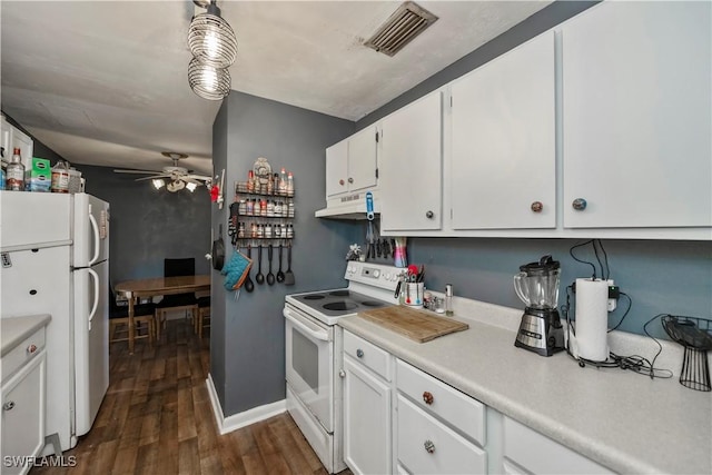 kitchen with dark wood-style flooring, visible vents, white cabinetry, white appliances, and under cabinet range hood