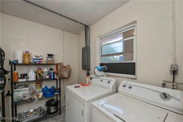 clothes washing area featuring laundry area, independent washer and dryer, and electric panel