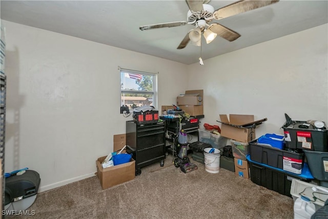 office space with carpet flooring, ceiling fan, and baseboards