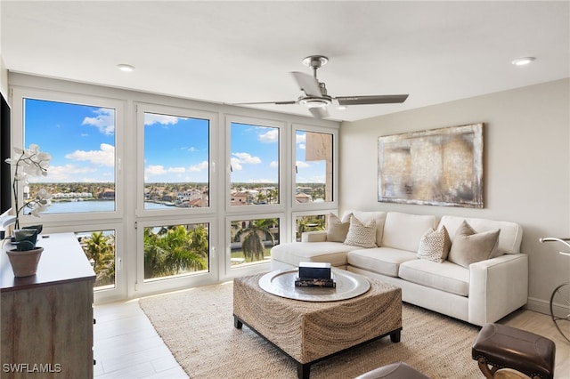 sunroom featuring ceiling fan