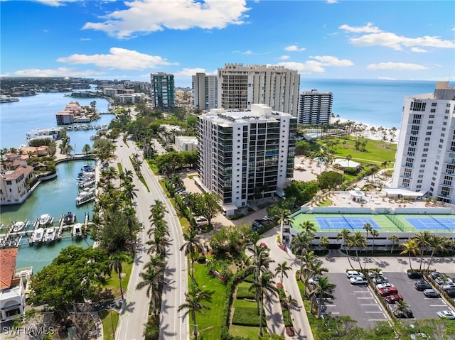 drone / aerial view featuring a view of city and a water view