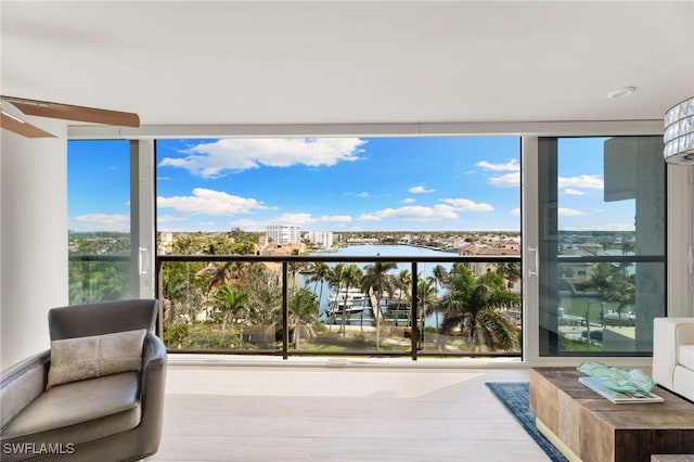 balcony featuring a water view and a view of city