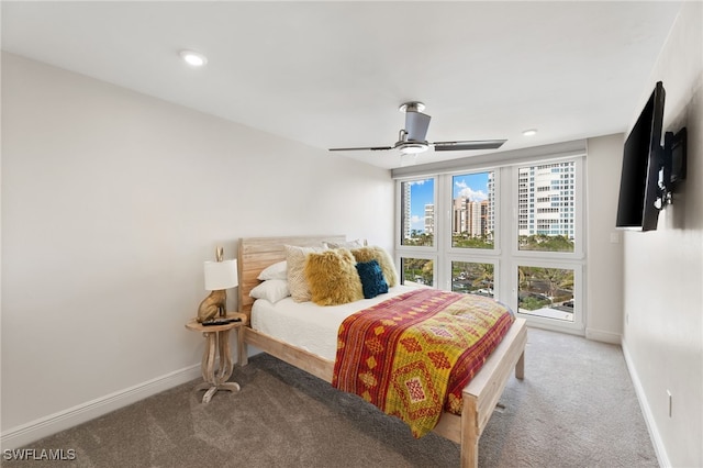 carpeted bedroom featuring recessed lighting, ceiling fan, and baseboards