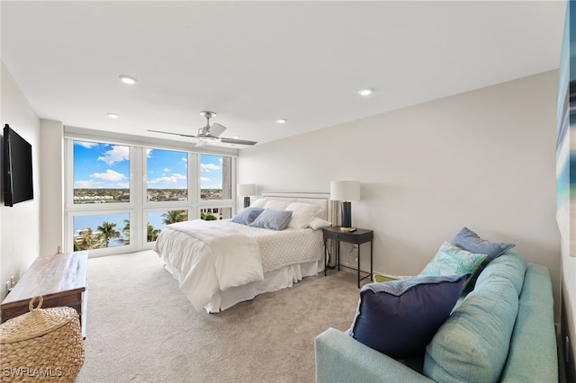 carpeted bedroom featuring a ceiling fan and recessed lighting