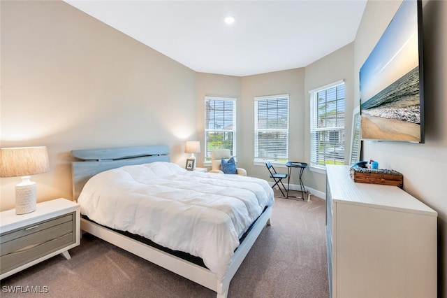 carpeted bedroom with baseboards