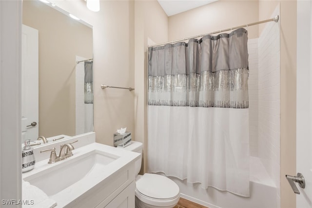 bathroom with shower / tub combo, vanity, and toilet