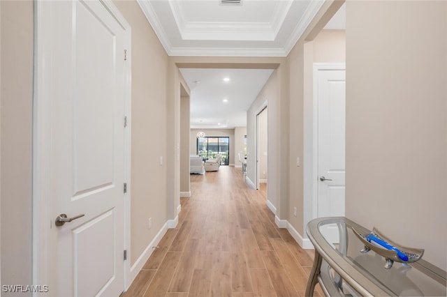 hall featuring recessed lighting, visible vents, baseboards, ornamental molding, and light wood finished floors