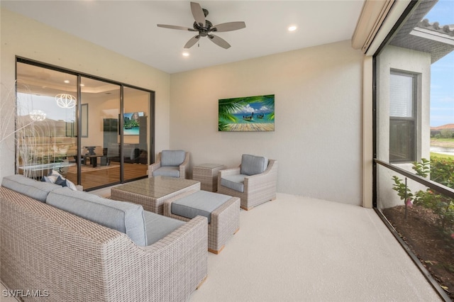 living area with a ceiling fan and recessed lighting