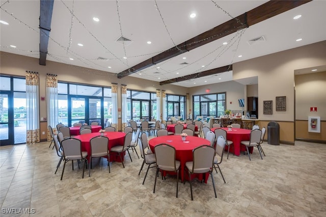 dining space with a high ceiling, beamed ceiling, visible vents, and recessed lighting