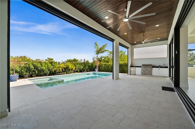 exterior space featuring a sink, ceiling fan, a patio, a grill, and an outdoor kitchen