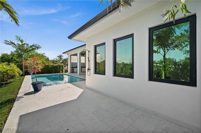 outdoor pool featuring a patio