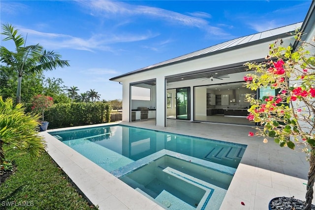 view of swimming pool with a pool with connected hot tub and a patio