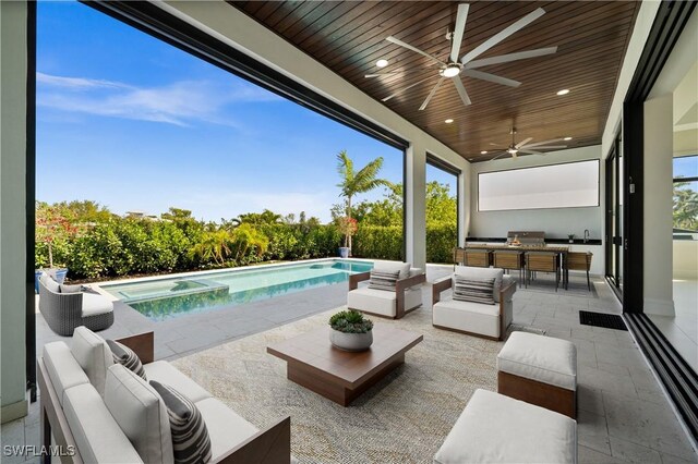 view of patio with outdoor dining space, a pool with connected hot tub, a sink, an outdoor hangout area, and an outdoor kitchen