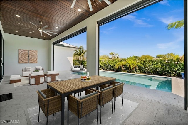 view of patio with ceiling fan, outdoor dining area, an outdoor pool, and an outdoor hangout area