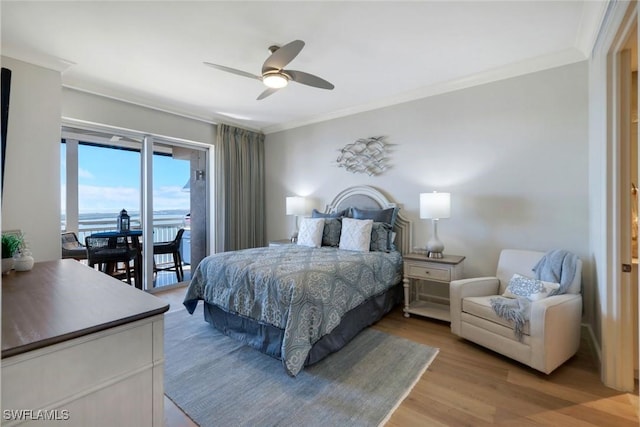 bedroom with a ceiling fan, access to outside, crown molding, and light wood-style flooring