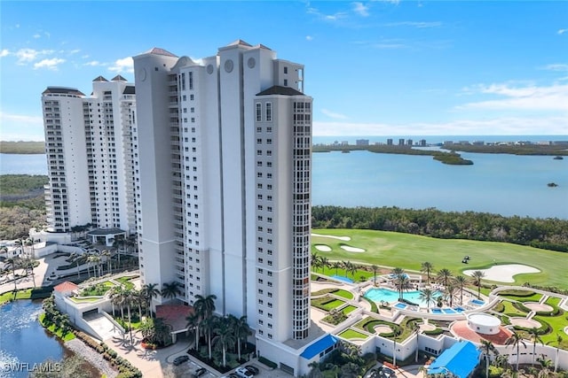 bird's eye view with a water view and golf course view