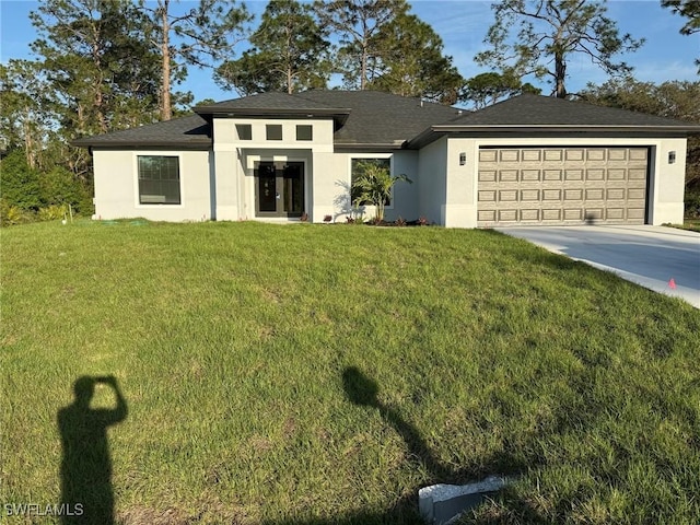 view of front facade featuring an attached garage, stucco siding, concrete driveway, and a front yard