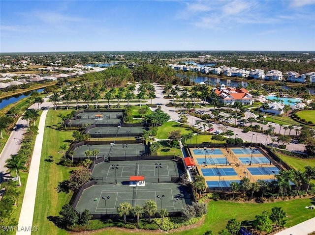 birds eye view of property with a water view