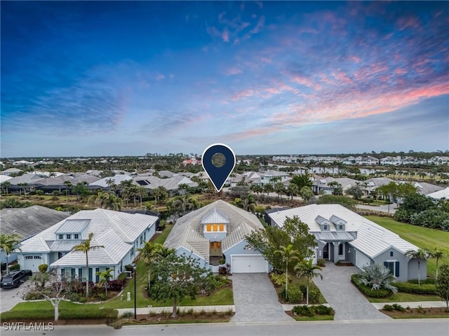 aerial view at dusk with a residential view