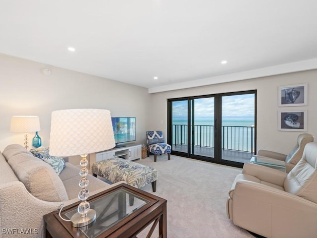 living room with recessed lighting and light colored carpet